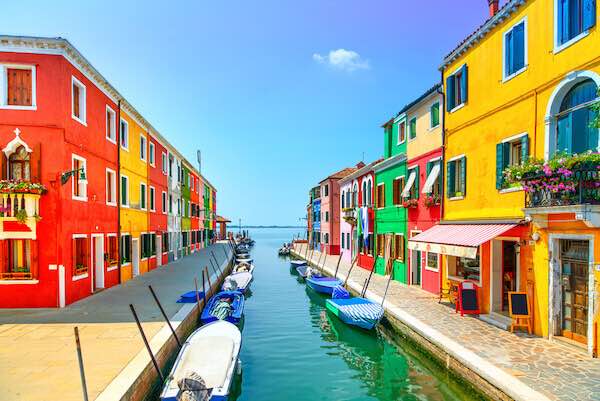 Visiting Burano Italy cover image: colorful houses on canal in Burano