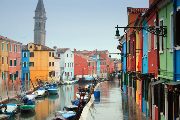 Burano colorful houses, canals and tower in the background on a winter day