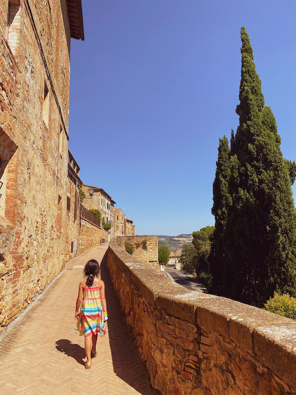 Pienza Tuscany with kid walking on bastions