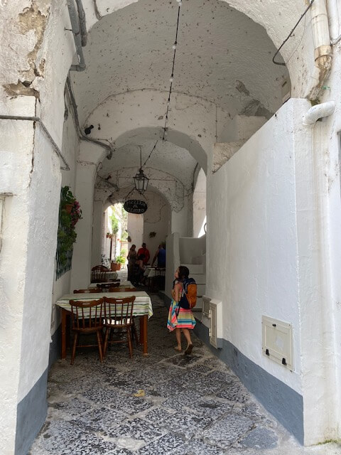 Covered Amalfi town with child walking
