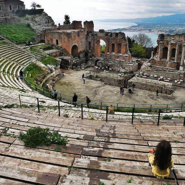 taormina theater with my daugther in a yellow sweater on one of the audience seats