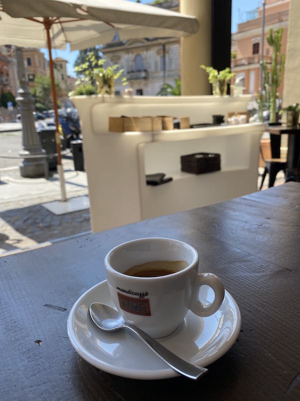 Coffee cup in outdoor cafe in Italy