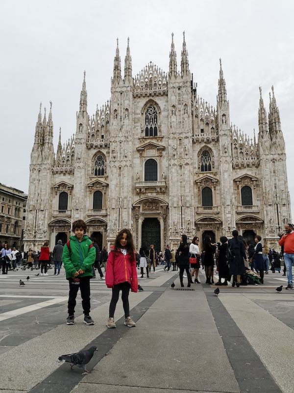 Children in front of Milan Duomo in winter 