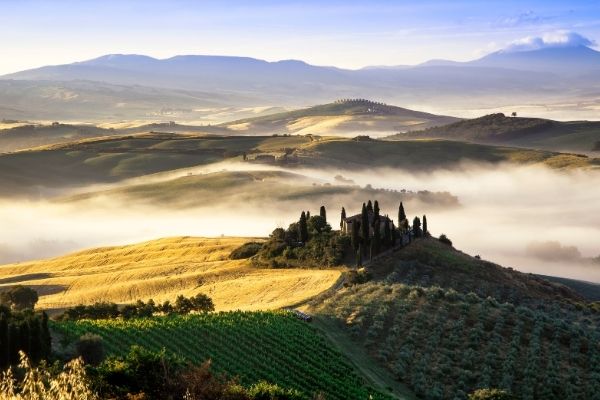 hills in Italy with low clouds