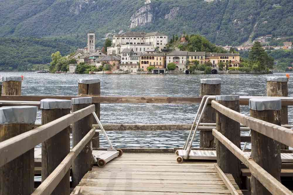 Lake Orta, Italy, with boardwalk in the foreground and island of orta san giulio
