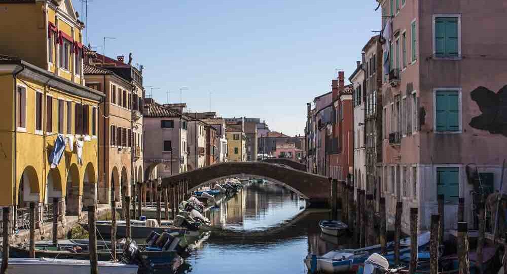 Canal in Chioggia, Italy with bridge