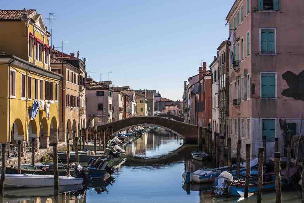 Canal in Chioggia, Italy with bridge