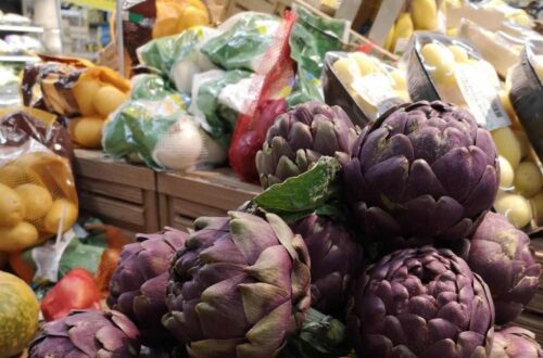 artichokes and other vegetables on Italian market stall
