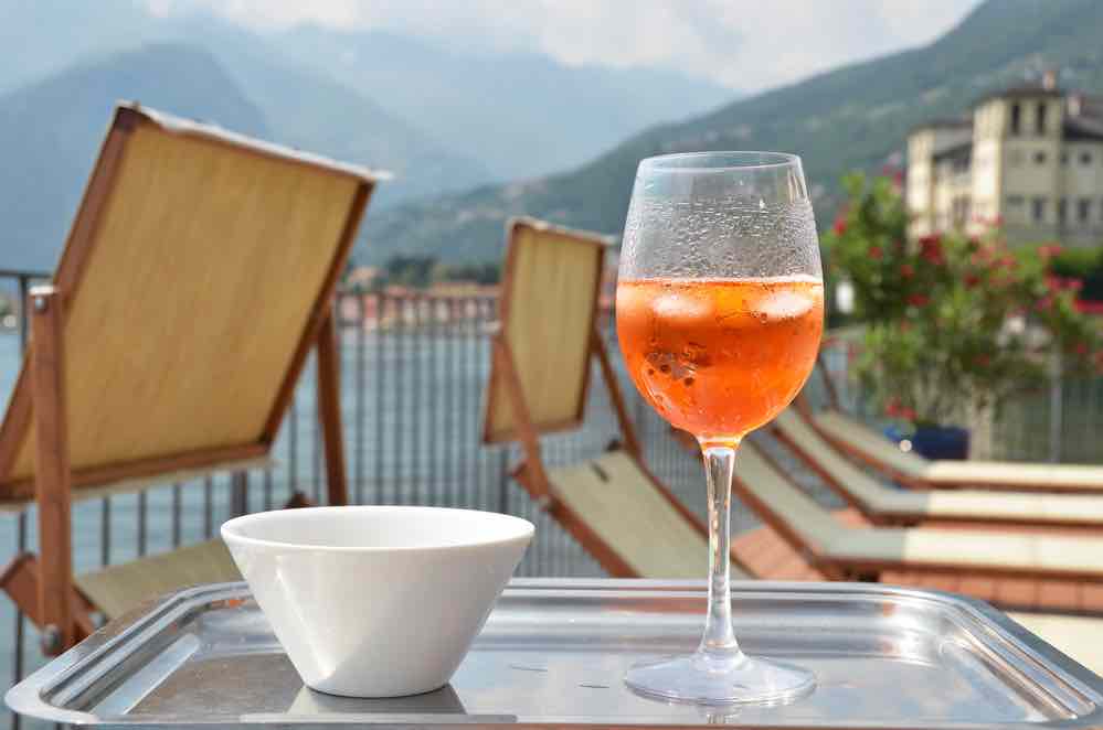 class of sprits with background view of Lake Como Italy
