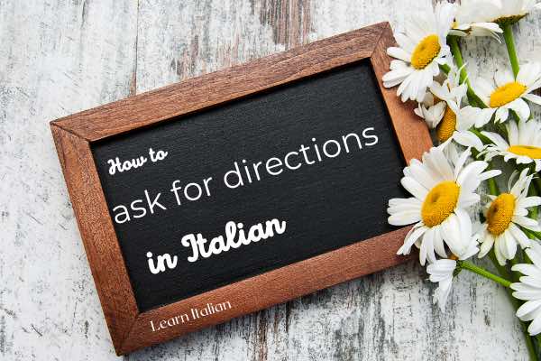 Blackboard with writing: how to ask for directions in Italian