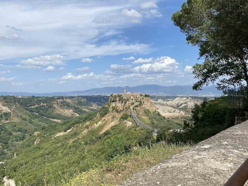 view of Civita di Bganoregio perched on top of its rock, taken from Bagnoregio