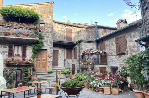 ancient square with flowers in Radicofani Italy