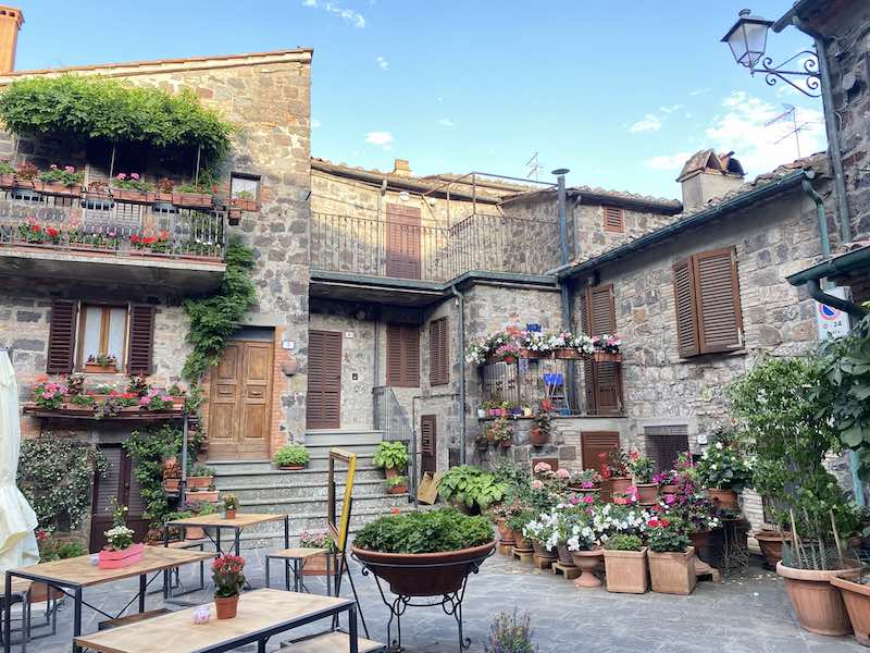 ancient square with flowers in Radicofani Italy