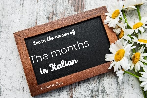 Blackboard with written: learn the names of the months in Italian
