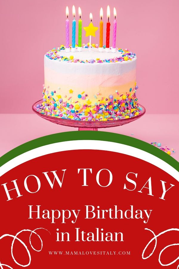 Birthday cake with candles and text: how to say happy birthday in Italian.