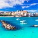 view of Otranto with blue sea and boats in the foreground