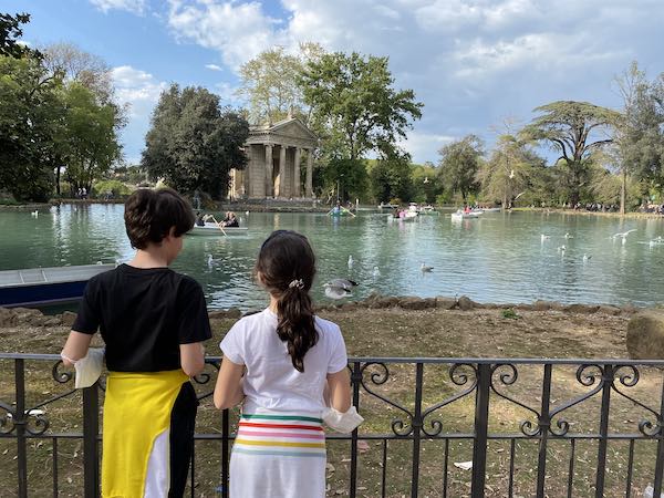 Borghese gardens Rome with kids watching aponsd with rowing boats