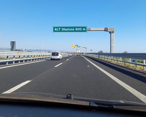 Rod sign announcing toll booth on italian motorway