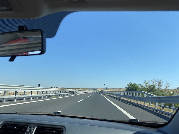Typical Italian toll road with two lanes, photographed from inside a car