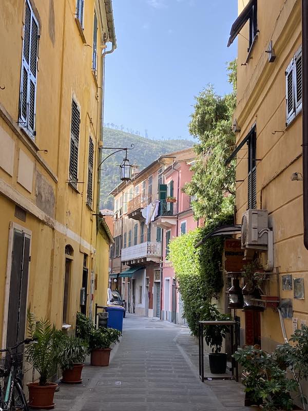 quiet street in Levanto with traditional colorful houses