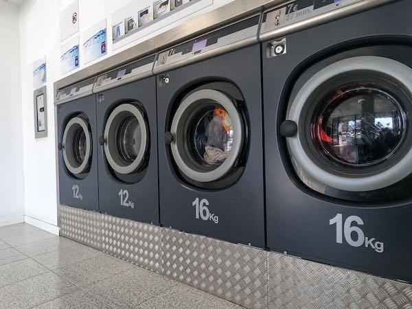Row of washing machines in laundromat