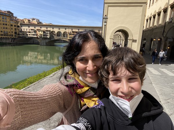My son and I during our Florence day trip, with Ponte vecchio in the background