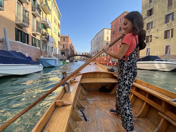 my daugher in venice in October rowing a boat, 