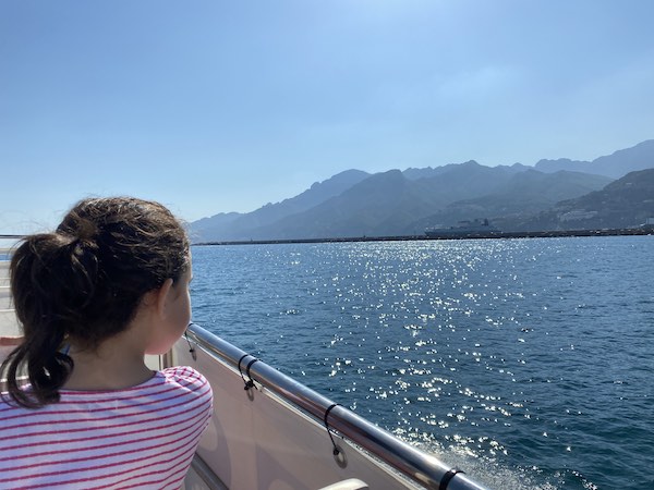 My daughter on a boat ride along the Amalfi Coast