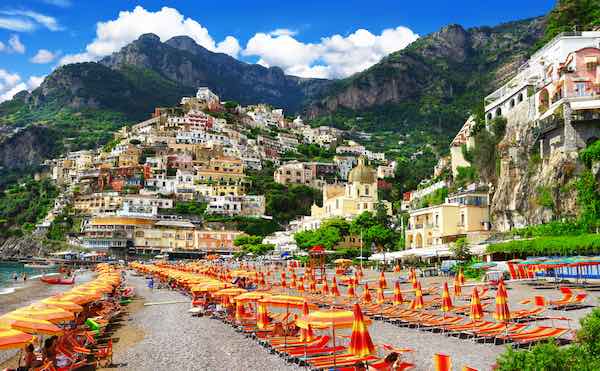 Positano, with beach and rows of sun umbrellas in the foreground