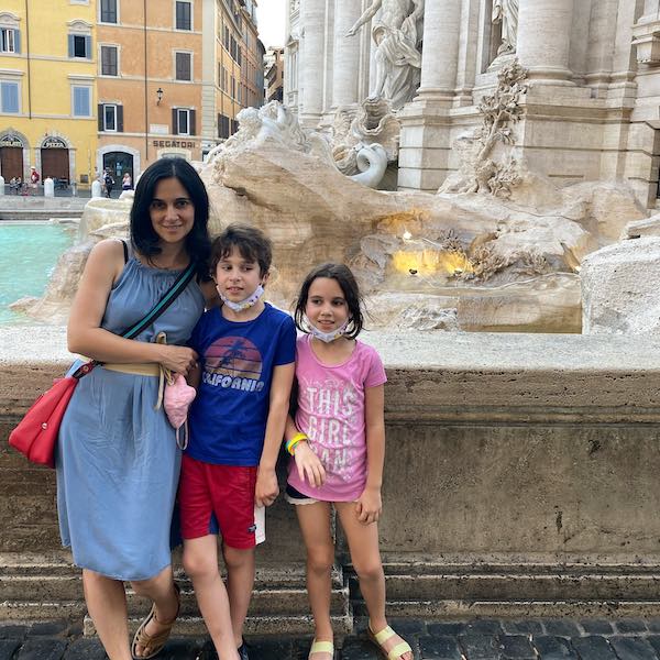Family in late June at Rome Trevi Fountain