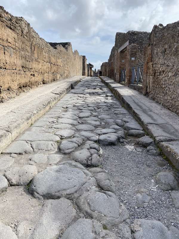 Ancient road in Pompeii with typical stone paving