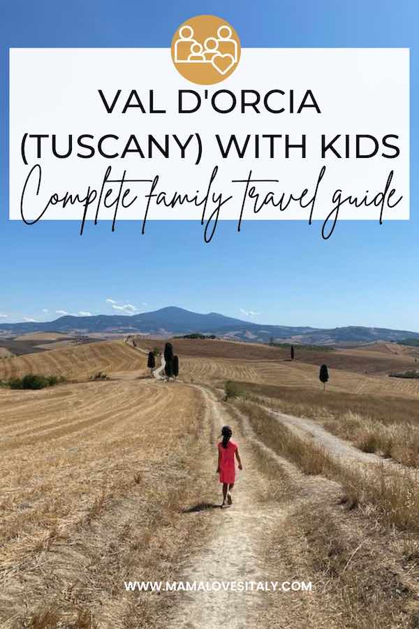 Child walking in Val d'Orcia towards a cluster of cypress trees. overlay text: val d'Orcia Tuscany with kids complete family travel guide 