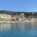 Santa Margherita Ligure seafront with colorful houses and umbrellas (seen from the sea)